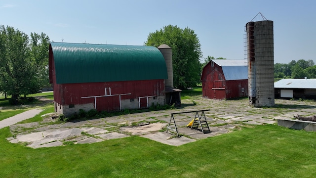 2523 E Wildcat, Saint Johns, MI 48879 - view of grassy yard with a barn and an outbuilding