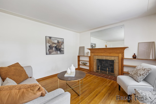 1665 7th St NW, Grand Rapids, MI 49504 - living area with wood finished floors and a fireplace