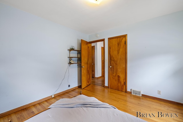 1665 7th St NW, Grand Rapids, MI 49504 - bedroom featuring baseboards and wood finished floors
