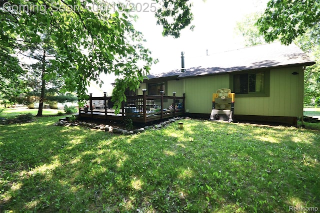 10010 Orchard Ridge Ct, Holly, MI 48442 - rear view of house featuring a wooden deck and a yard