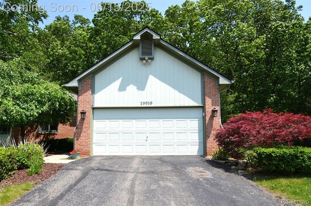 10010 Orchard Ridge Ct, Holly, MI 48442 - garage featuring asphalt driveway