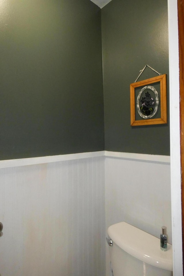 552 W Main St, Niles, MI 49120 - bathroom with a wainscoted wall and toilet