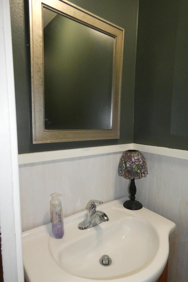 552 W Main St, Niles, MI 49120 - bathroom featuring a sink and a wainscoted wall