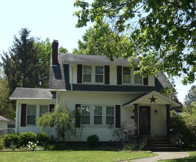 552 W Main St, Niles, MI 49120 - view of front of property with a front lawn and a chimney