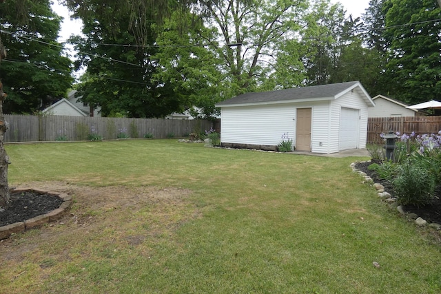 552 W Main St, Niles, MI 49120 - fenced backyard with an outbuilding and a detached garage