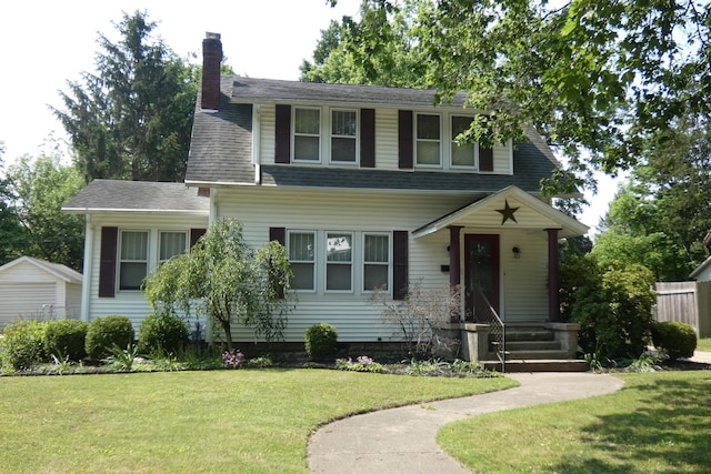 552 W Main St, Niles, MI 49120 - view of front of property with a chimney, a front lawn, and roof with shingles