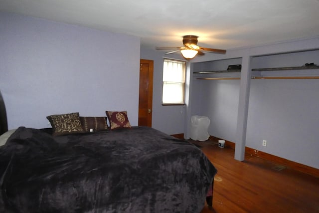 552 W Main St, Niles, MI 49120 - bedroom with wood finished floors, two closets, and a ceiling fan