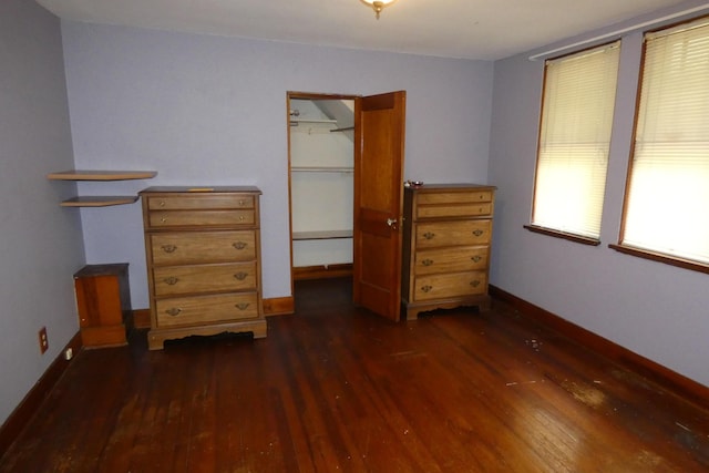 552 W Main St, Niles, MI 49120 - bedroom with dark wood-style flooring, a spacious closet, and a closet