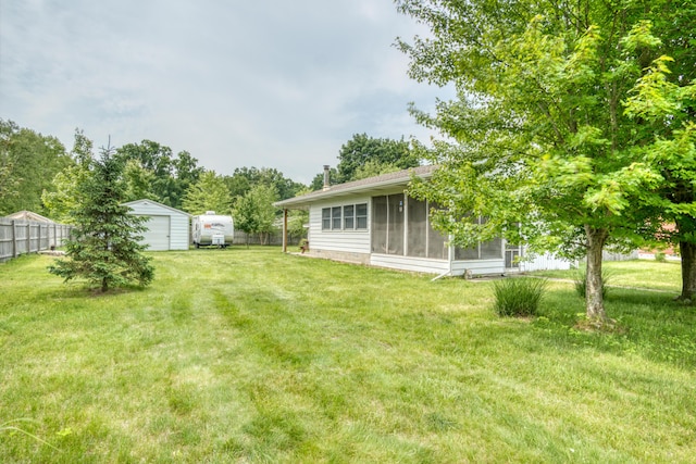 8182 Hardy Dr, Newaygo, MI 49337 - view of yard featuring a sunroom, a garage, and a shed