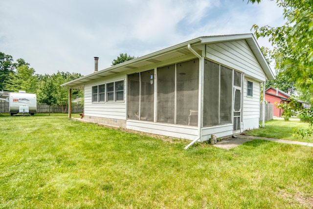 8182 Hardy Dr, Newaygo, MI 49337 - rear view of house featuring a sunroom