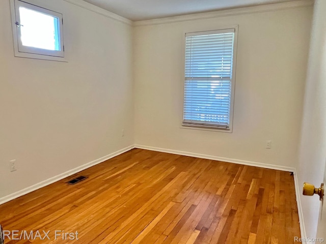 256 Withington St, Ferndale, MI 48220 - unfurnished room with wood-type flooring and crown molding