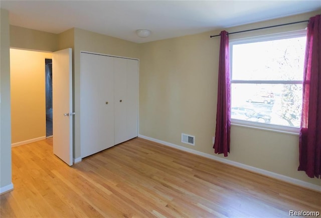 4030 W 13 Mile Rd Unit 3, Royal Oak, MI 48073 - unfurnished bedroom featuring light wood finished floors and a closet