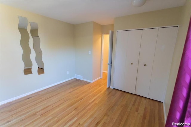 4030 W 13 Mile Rd Unit 3, Royal Oak, MI 48073 - unfurnished bedroom featuring wood finished floors and a closet