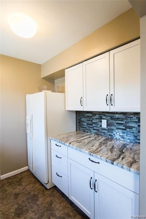 4030 W 13 Mile Rd Unit 3, Royal Oak, MI 48073 - kitchen featuring backsplash, white cabinetry, light stone countertops, and white refrigerator with ice dispenser