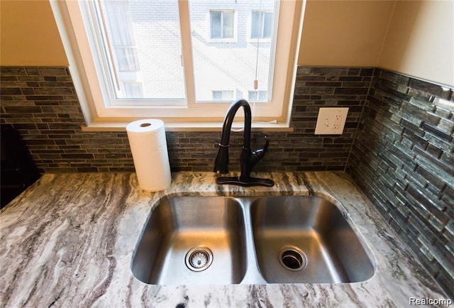 4030 W 13 Mile Rd Unit 3, Royal Oak, MI 48073 - kitchen view of a sink and stone counters