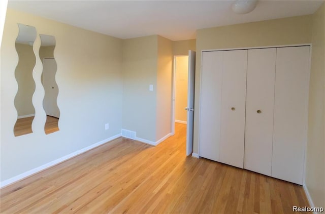 4030 W 13 Mile Rd Unit 3, Royal Oak, MI 48073 - unfurnished bedroom featuring wood finished floors and a closet