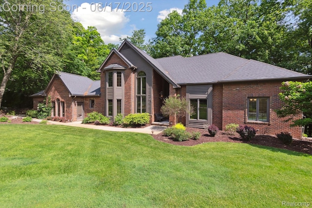 2020 Pine Hollow Trl, Brighton, MI 48114 - view of front of property featuring brick siding, a front lawn, and a shingled roof