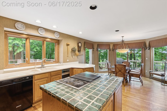 2020 Pine Hollow Trl, Brighton, MI 48114 - kitchen featuring black dishwasher, tile counters, stovetop with downdraft, light wood-style flooring, and recessed lighting