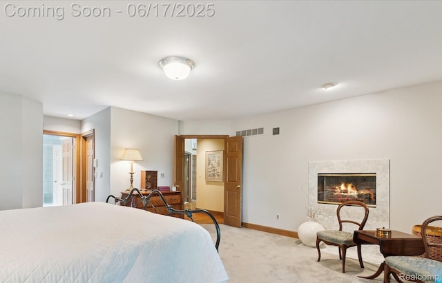 2020 Pine Hollow Trl, Brighton, MI 48114 - bedroom with light carpet and a fireplace