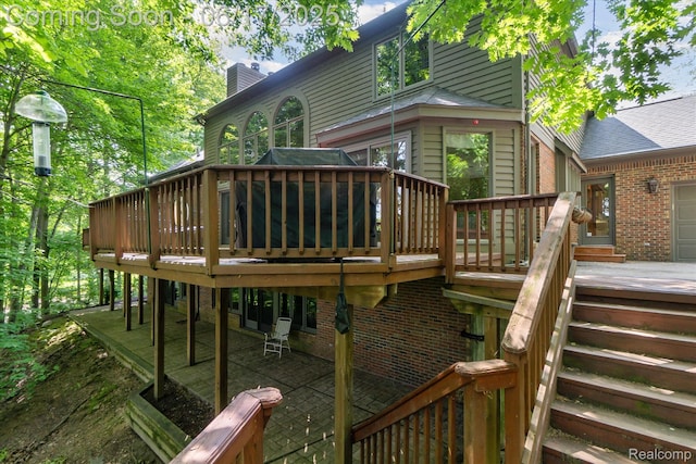 2020 Pine Hollow Trl, Brighton, MI 48114 - wooden deck with a patio area