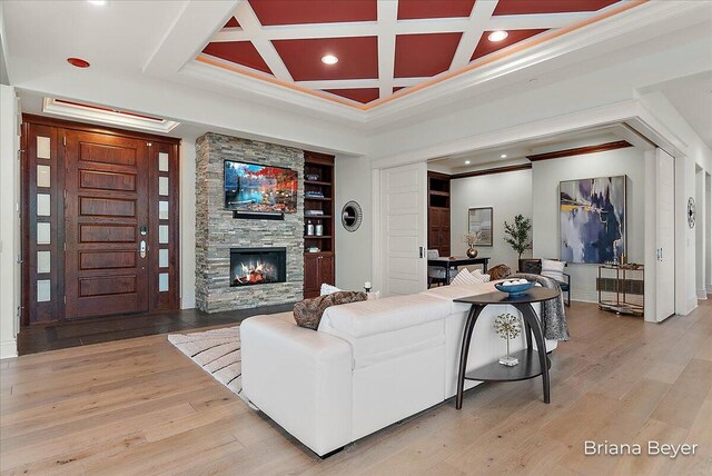 335 Bridge St NW Unit 3102, Grand Rapids, MI 49504 - living room with crown molding, a fireplace, recessed lighting, light wood-style flooring, and coffered ceiling