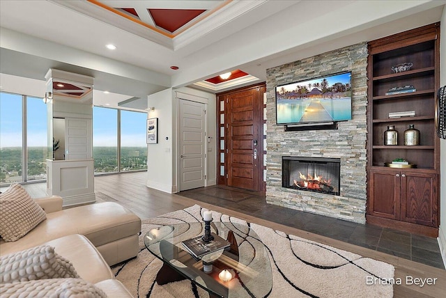 335 Bridge St NW Unit 3102, Grand Rapids, MI 49504 - living room with ornamental molding, a fireplace, wood finished floors, and recessed lighting