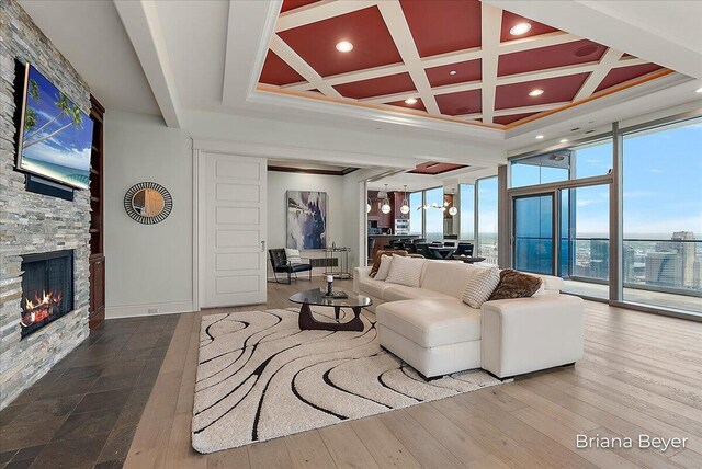 335 Bridge St NW Unit 3102, Grand Rapids, MI 49504 - living area featuring a fireplace, coffered ceiling, beam ceiling, wood finished floors, and recessed lighting
