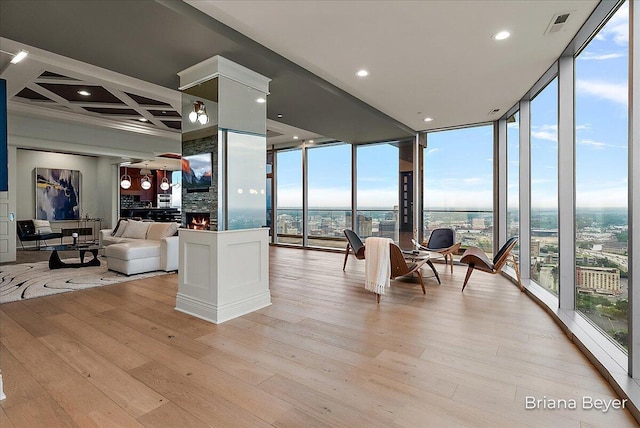 335 Bridge St NW Unit 3102, Grand Rapids, MI 49504 - living room featuring floor to ceiling windows, plenty of natural light, and light wood finished floors