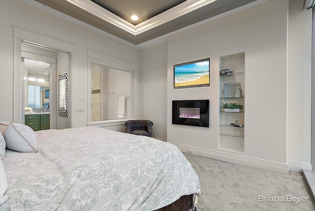 335 Bridge St NW Unit 3102, Grand Rapids, MI 49504 - bedroom featuring a glass covered fireplace, carpet floors, crown molding, recessed lighting, and a tray ceiling