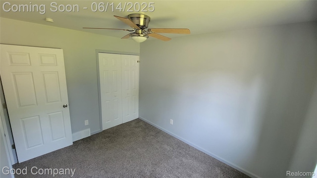 8544 Russell St, Shelby Twp, MI 48317 - unfurnished bedroom with a closet, dark colored carpet, and ceiling fan