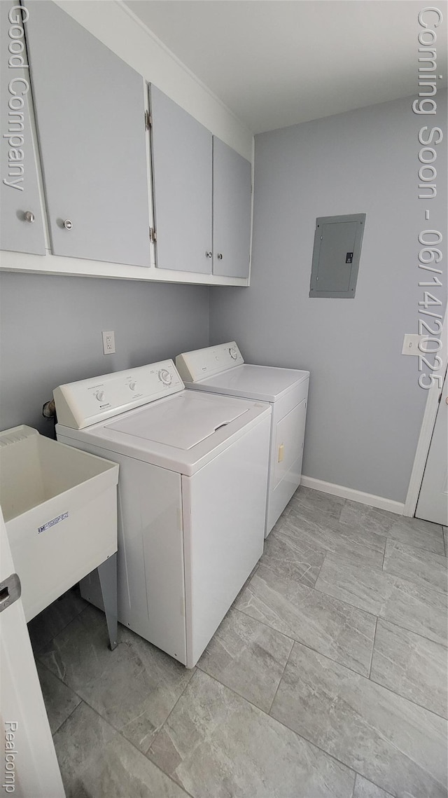 8544 Russell St, Shelby Twp, MI 48317 - washroom with electric panel, washer and clothes dryer, and cabinet space