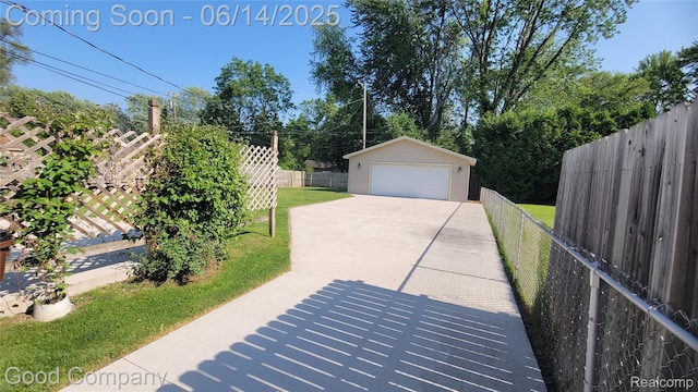 8544 Russell St, Shelby Twp, MI 48317 - fenced backyard featuring a detached garage and an outbuilding