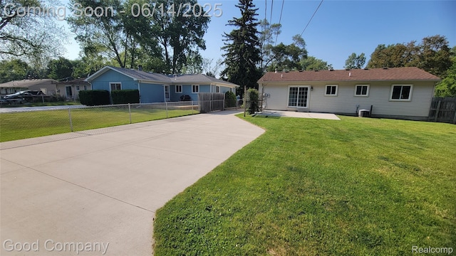 8544 Russell St, Shelby Twp, MI 48317 - back of property with driveway and a patio area