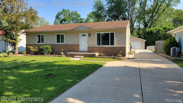 8544 Russell St, Shelby Twp, MI 48317 - view of front of home with brick siding, a front yard, an outbuilding, and a detached garage