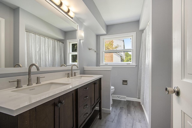6737 Cypress St, Portage, MI 49024 - bathroom featuring double vanity and wood finished floors