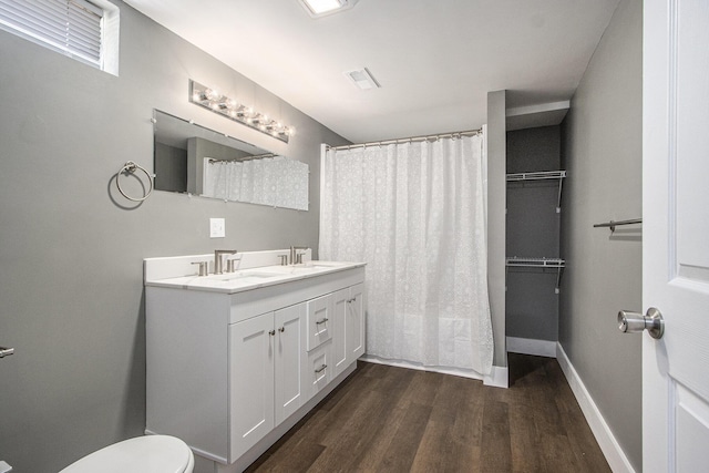 6737 Cypress St, Portage, MI 49024 - bathroom with wood finished floors, double vanity, and a shower with shower curtain