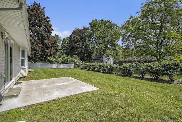 6737 Cypress St, Portage, MI 49024 - fenced backyard featuring a patio