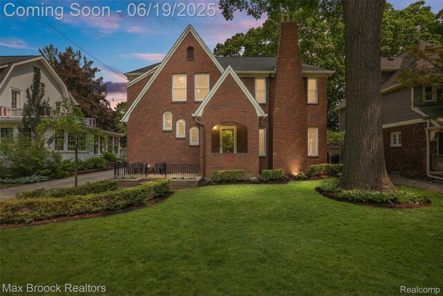 11 Sylvan Ave, Pleasant Ridge, MI 48069 - english style home with a chimney, a lawn, and brick siding