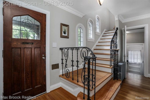 11 Sylvan Ave, Pleasant Ridge, MI 48069 - entrance foyer featuring healthy amount of natural light, wood finished floors, stairs, and crown molding