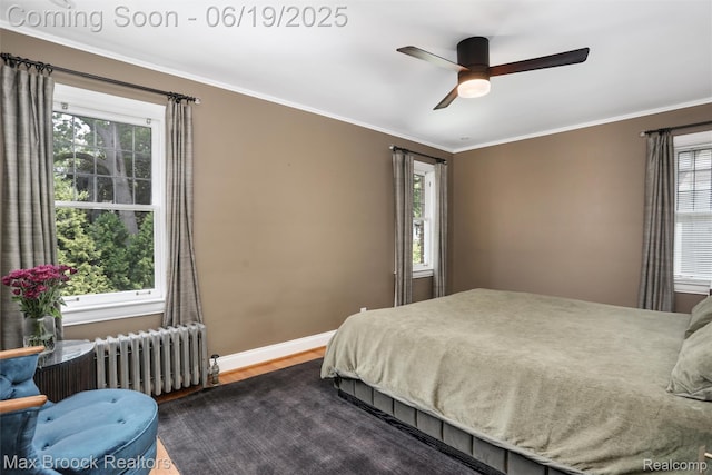 11 Sylvan Ave, Pleasant Ridge, MI 48069 - bedroom with radiator heating unit, multiple windows, wood finished floors, and crown molding