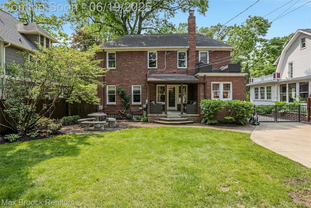 11 Sylvan Ave, Pleasant Ridge, MI 48069 - back of property featuring brick siding, a chimney, and a shingled roof