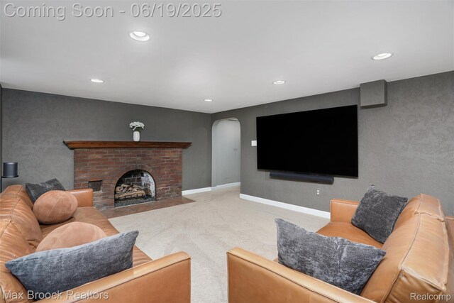 11 Sylvan Ave, Pleasant Ridge, MI 48069 - carpeted living room with arched walkways, recessed lighting, and a fireplace
