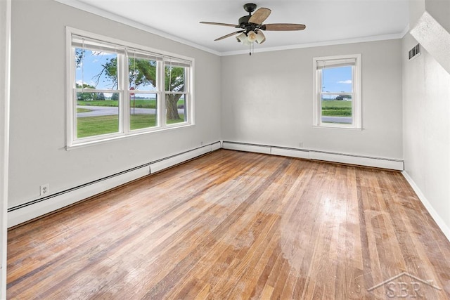 490 W Wilder Rd, Auburn, MI 48611 - spare room with light wood finished floors, a baseboard radiator, plenty of natural light, and ornamental molding