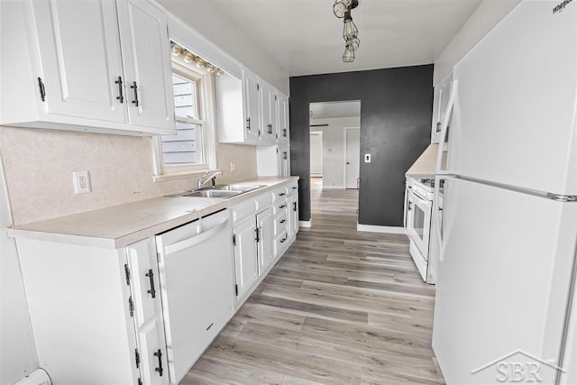 490 W Wilder Rd, Auburn, MI 48611 - kitchen with white appliances, white cabinetry, and light countertops