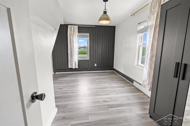 490 W Wilder Rd, Auburn, MI 48611 - empty room featuring plenty of natural light and wood finished floors