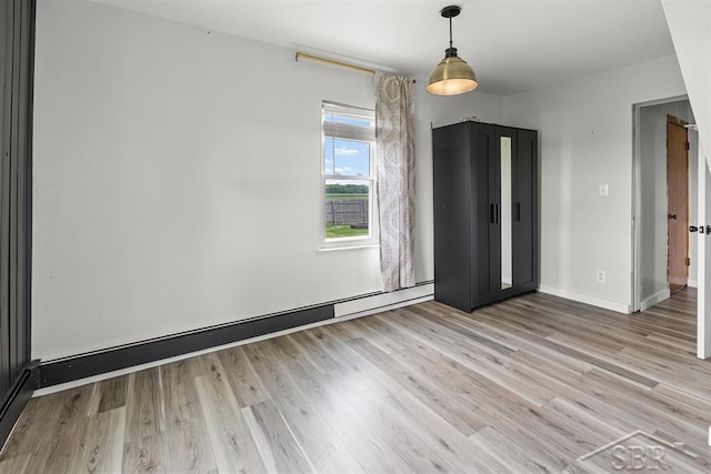 490 W Wilder Rd, Auburn, MI 48611 - unfurnished room with baseboard heating and light wood finished floors