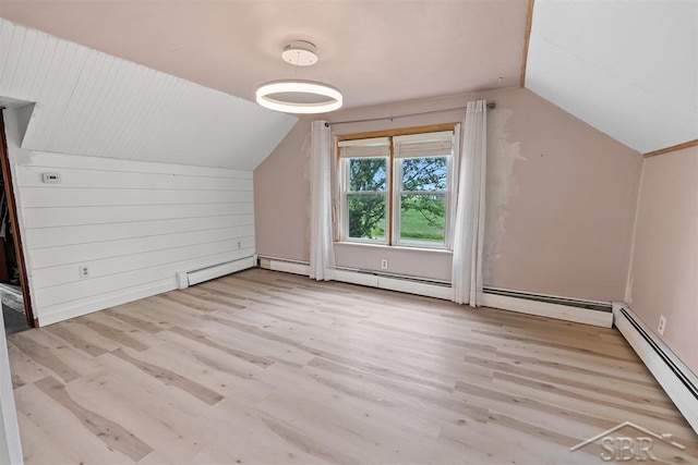 490 W Wilder Rd, Auburn, MI 48611 - bonus room featuring baseboard heating, wood finished floors, and vaulted ceiling