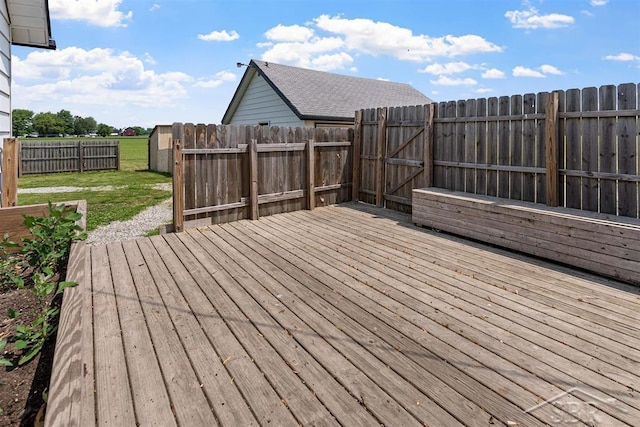 490 W Wilder Rd, Auburn, MI 48611 - wooden terrace with a fenced backyard and a gate