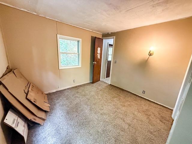 7671 S 27th Rd, Cadillac, MI 49601 - carpeted empty room featuring baseboards