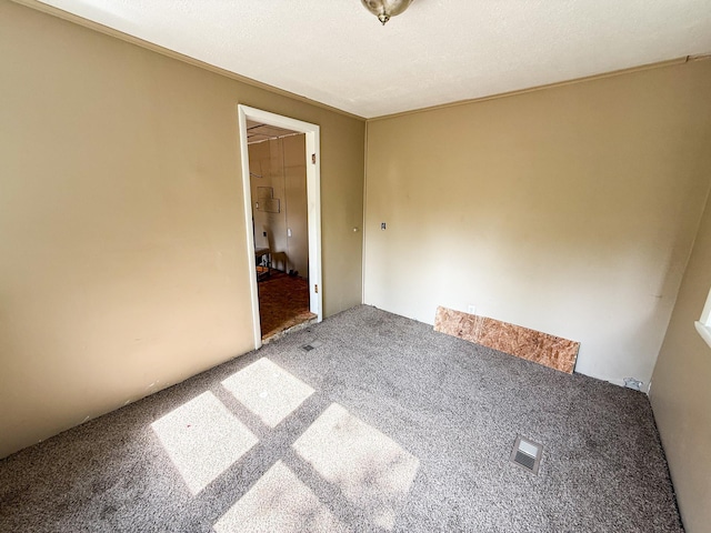 7671 S 27th Rd, Cadillac, MI 49601 - spare room featuring carpet